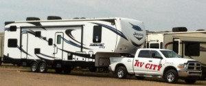 rv city truck towing a Seismic